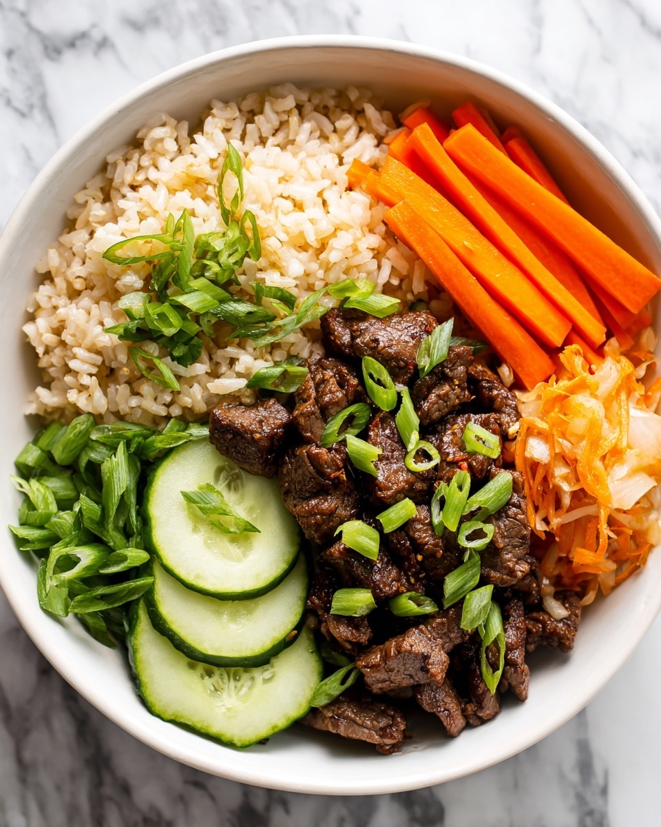 A white bowl is filled with four distinct sections of food on a white marbled surface. The base layer consists of light brown rice covering the majority of the bowl. On top of the rice sits a pile of dark brown cooked meat pieces garnished with small green onion slices. To one side, there are bright orange thin carrot sticks arranged neatly. Next to the carrots, fresh green cucumber strips are placed in a small bundle. On the opposite side near the meat, there is a small portion of light orange shredded pickled vegetables. photo taken with an iphone --ar 4:5 --v 7
