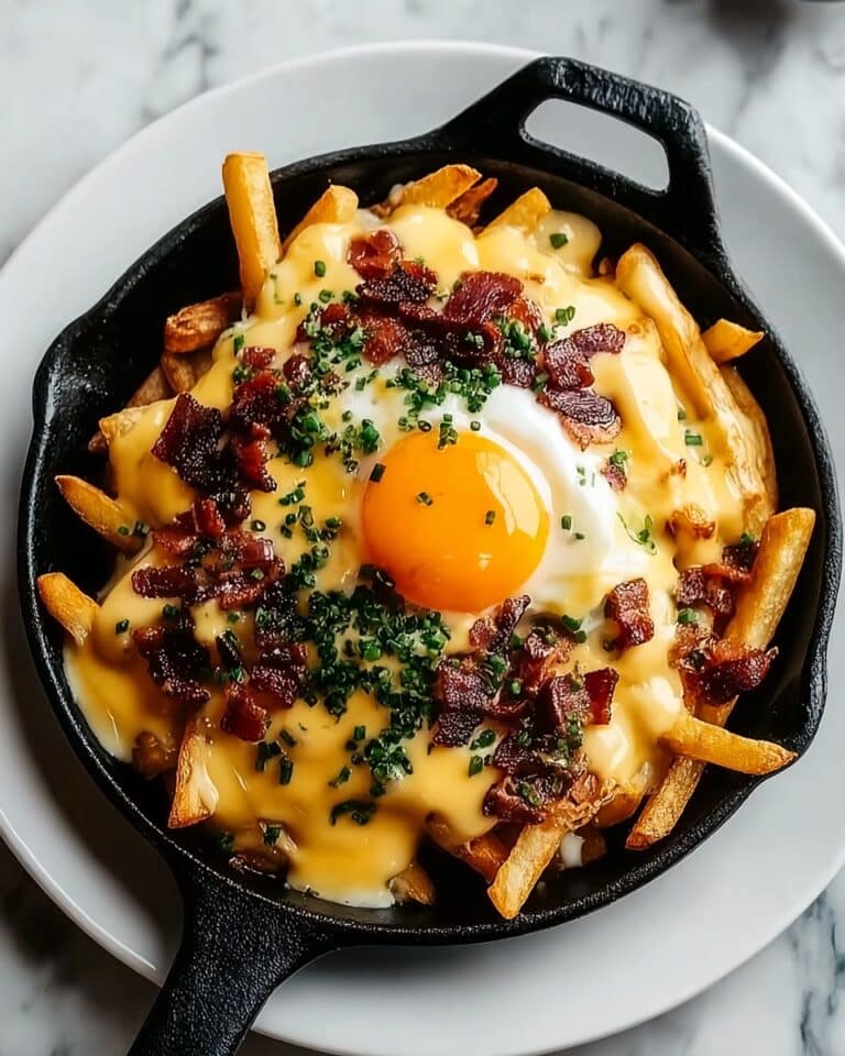 Breakfast Poutine with Crispy Hash Browns, Eggs, Cheese, Gravy, and Hollandaise Sauce Recipe