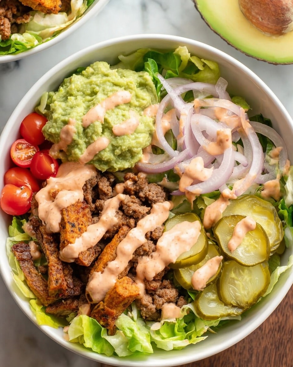 A white bowl filled with several layers starting with a base of fresh green lettuce. On top, there are sections of crushed brown ground beef, bright green guacamole, yellowish-green pickle slices, red cherry tomato halves, and crispy brown chicken pieces. Thin light purple onion rings are scattered over the ingredients. Everything is drizzled with a light pink creamy sauce and sprinkled lightly with green herbs. The bowl is set on a white marbled surface with avocado halves and tomato pieces around it. Photo taken with an iphone --ar 4:5 --v 7